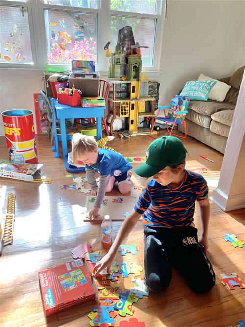 Boys working on puzzles during COVID 